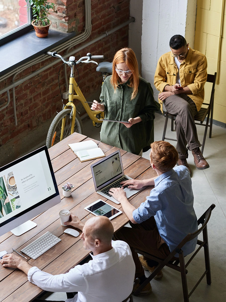 The PPC Team meeting with a vase on the window sill